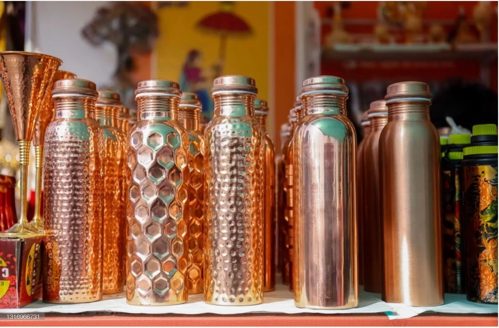 Showing a number of copper bottles together
